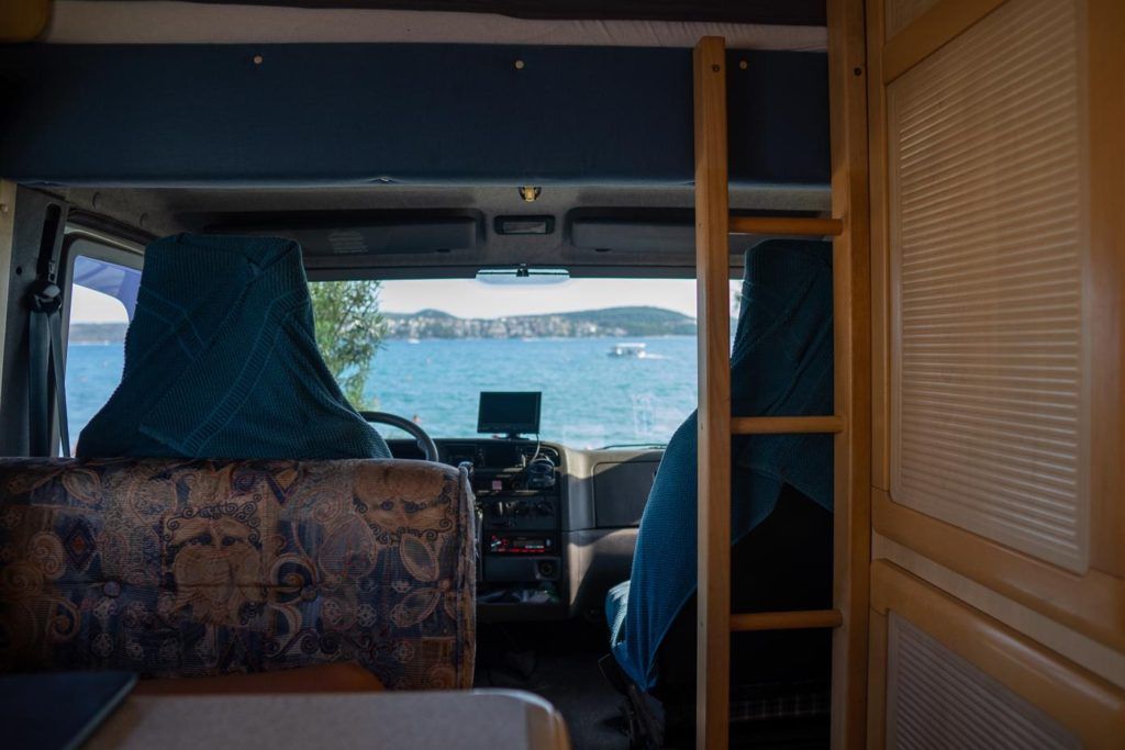 Europe by campervan - Inside a campervan looking at ocean